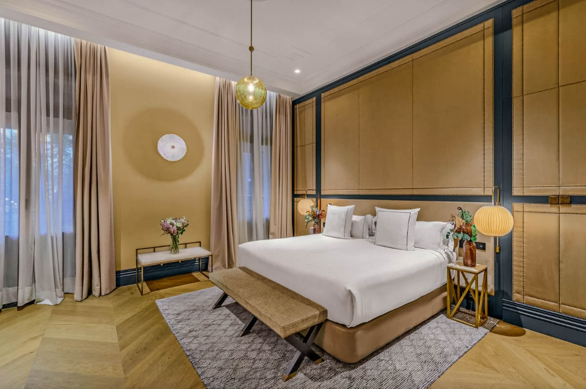 Bedroom in the Master Suite at CoolRooms Palacio de Atocha with king-size bed and panoramic windows. (Madrid, Spain)