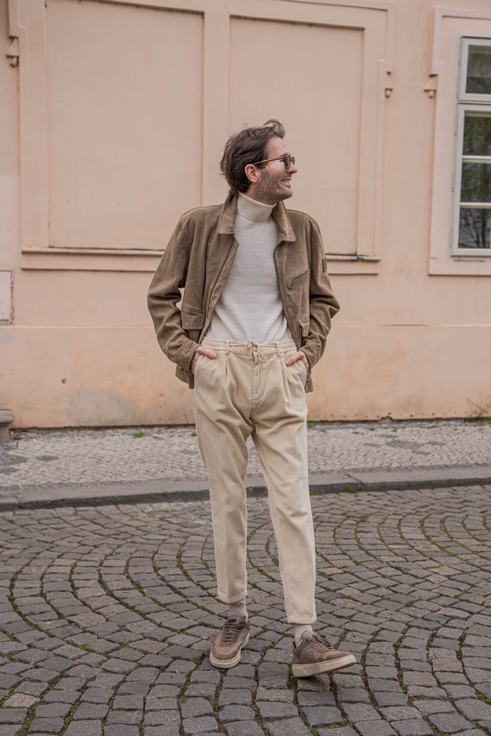 Marko Tadić, founder of Mr.M by Marko Tadić blog, mid-body shot of Loro Piana cream wide-wale corduroy trousers with double pleats and tonal Fratelli Rossetti sneakers.