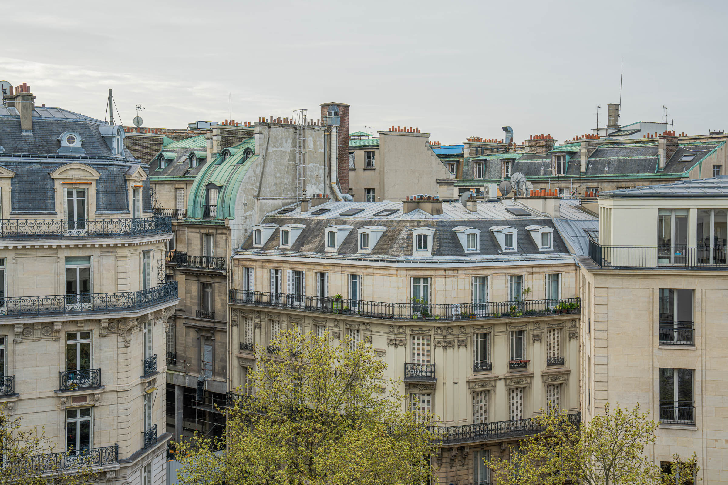 Classic Paris rooftops with zinc and copper roofs, chimneys and dormer windows seen from Hôtel Napoléon Paris, photo by Marko Tadić, founder of Mr.M by Marko Tadić blog