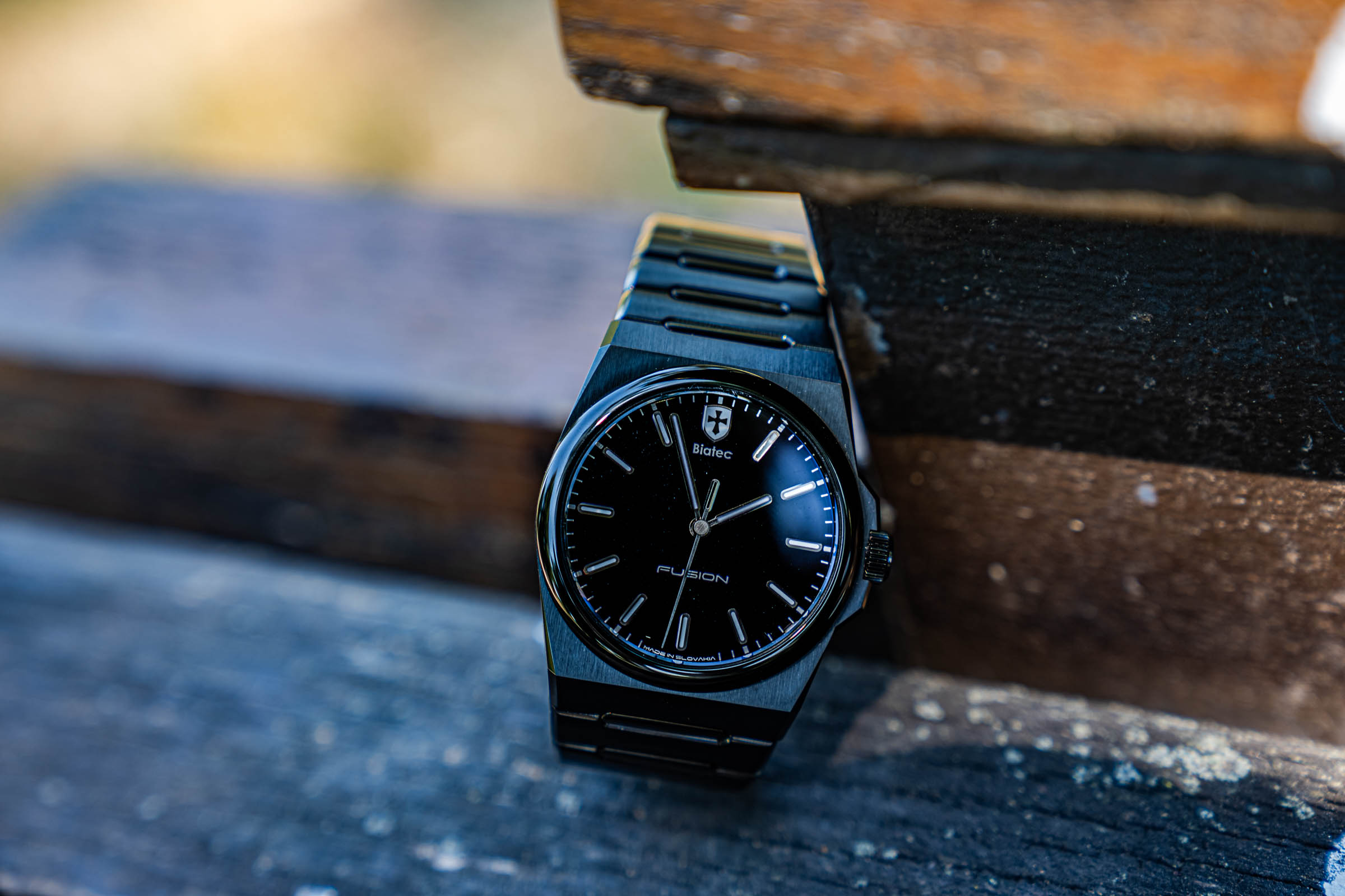 Close wrist shot of the Slovak-made Biatec Fusion 03 automatic watch, worn by Marko Tadić and framed by double-breasted denim jacket lapels
