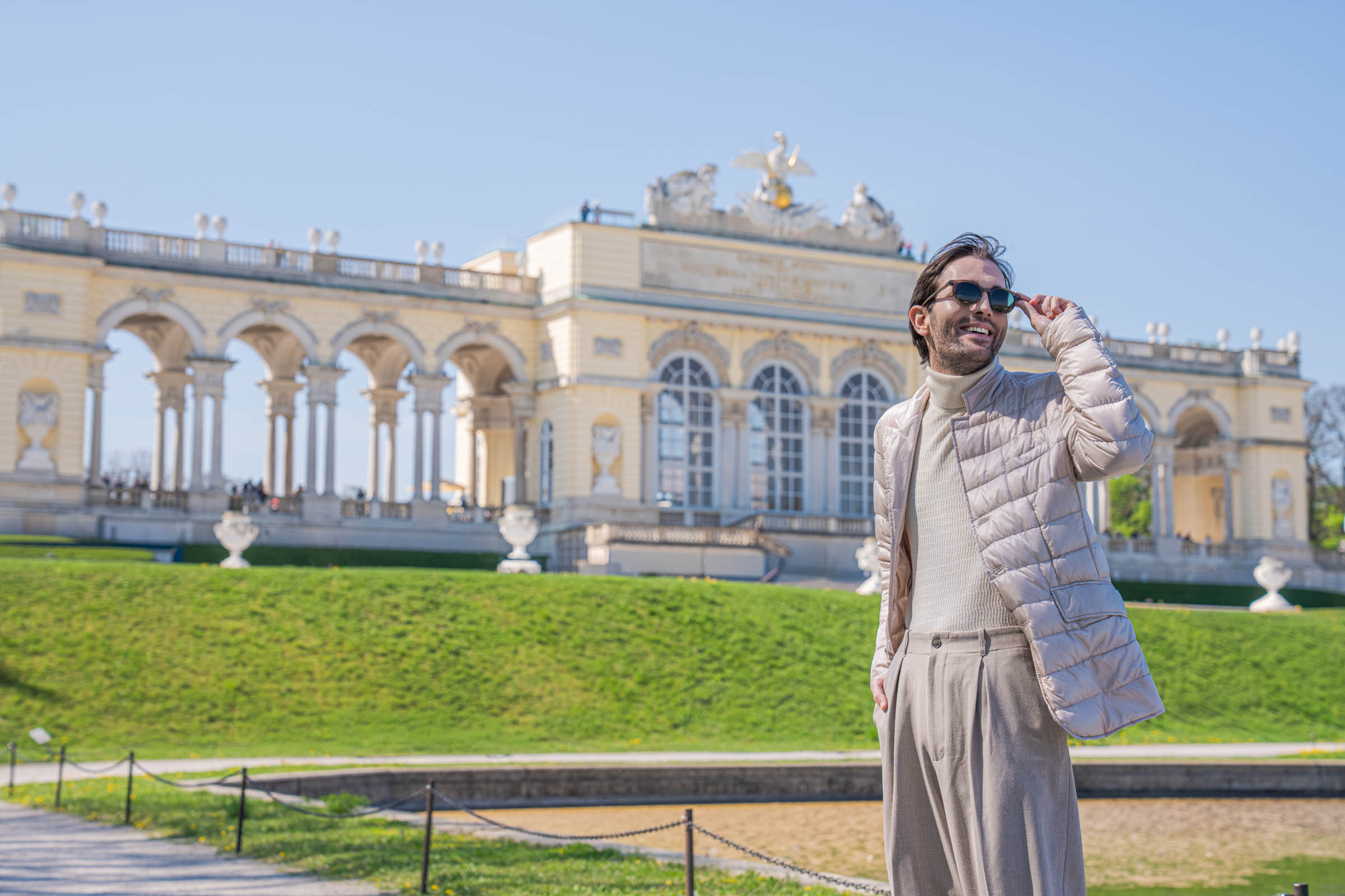 Marko Tadić, founder of the Mr.M blog, adjusting his FAÇONNABLE sunglasses in front of the Gloriette at Schönbrunn Palace in Vienna
