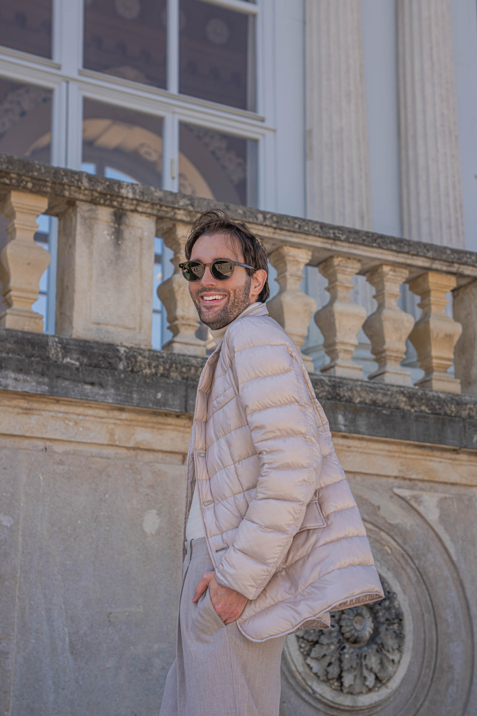 Marko Tadić, founder of the Mr.M blog, walking below the Gloriette facade with its imperial eagle and Latin inscription at Schönbrunn