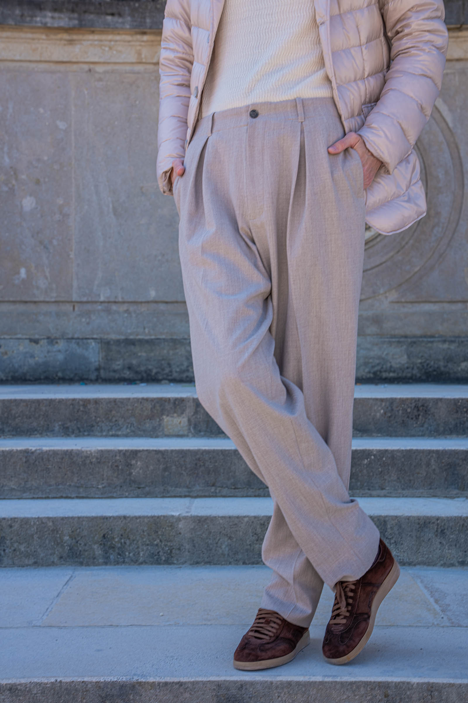 Santoni Oly brown suede sneakers in a crossed-leg pose, worn by Marko Tadić of the Mr.M blog, with the Gloriette blurred in the background