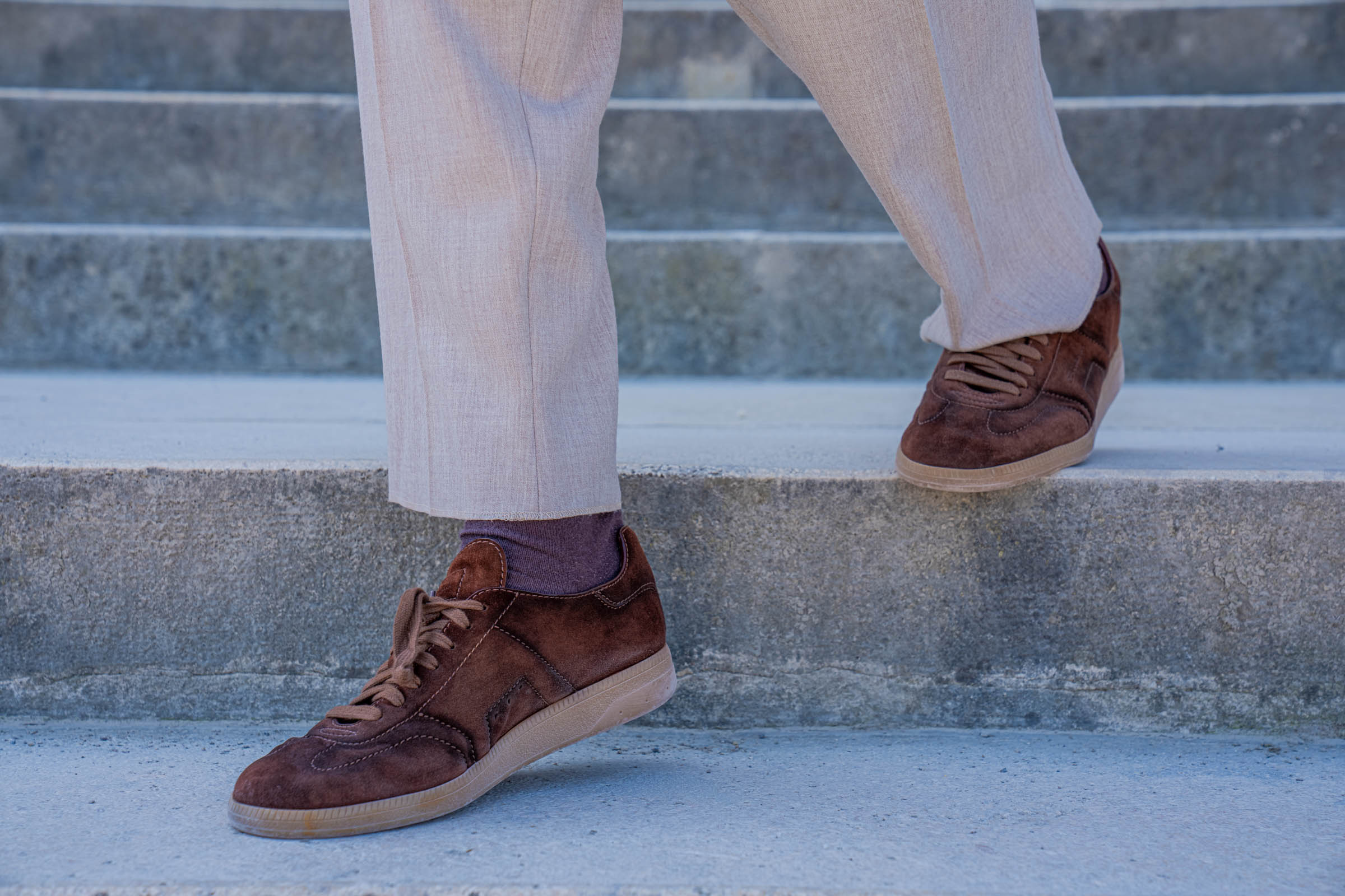Santoni Oly suede sneakers and beige Armani trousers on the stone steps of the Gloriette, worn by Marko Tadić of the Mr.M blog