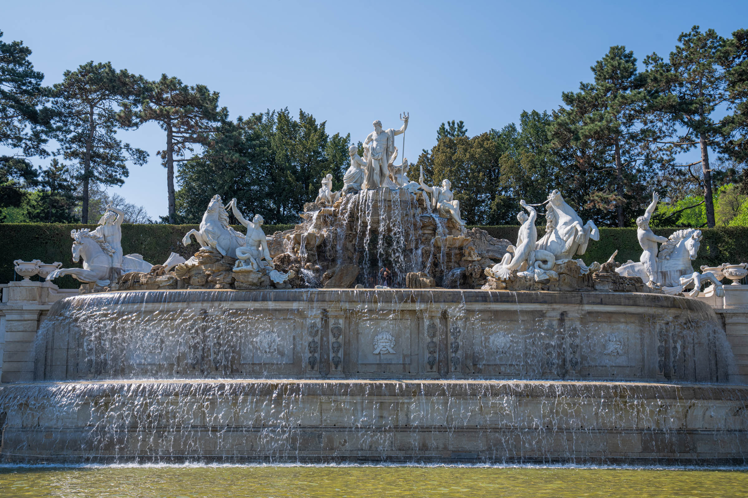 Monumental Neptune Fountain at Schönbrunn Palace Vienna with sea god sculptures and waterfalls