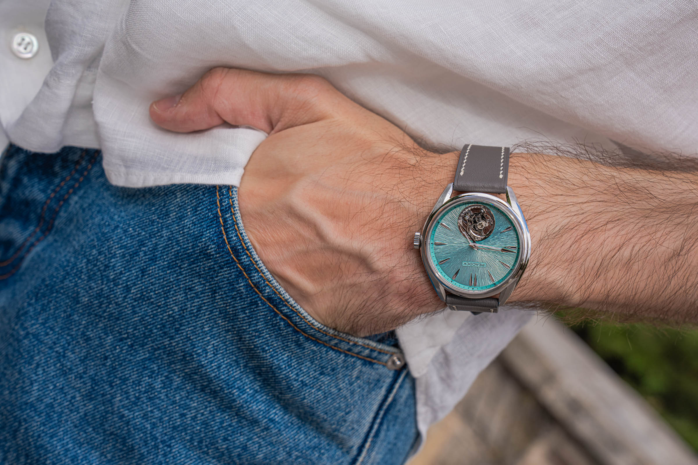 Grey calfskin strap of the Peacock tourbillon over Valentino jeans, worn by Marko Tadić