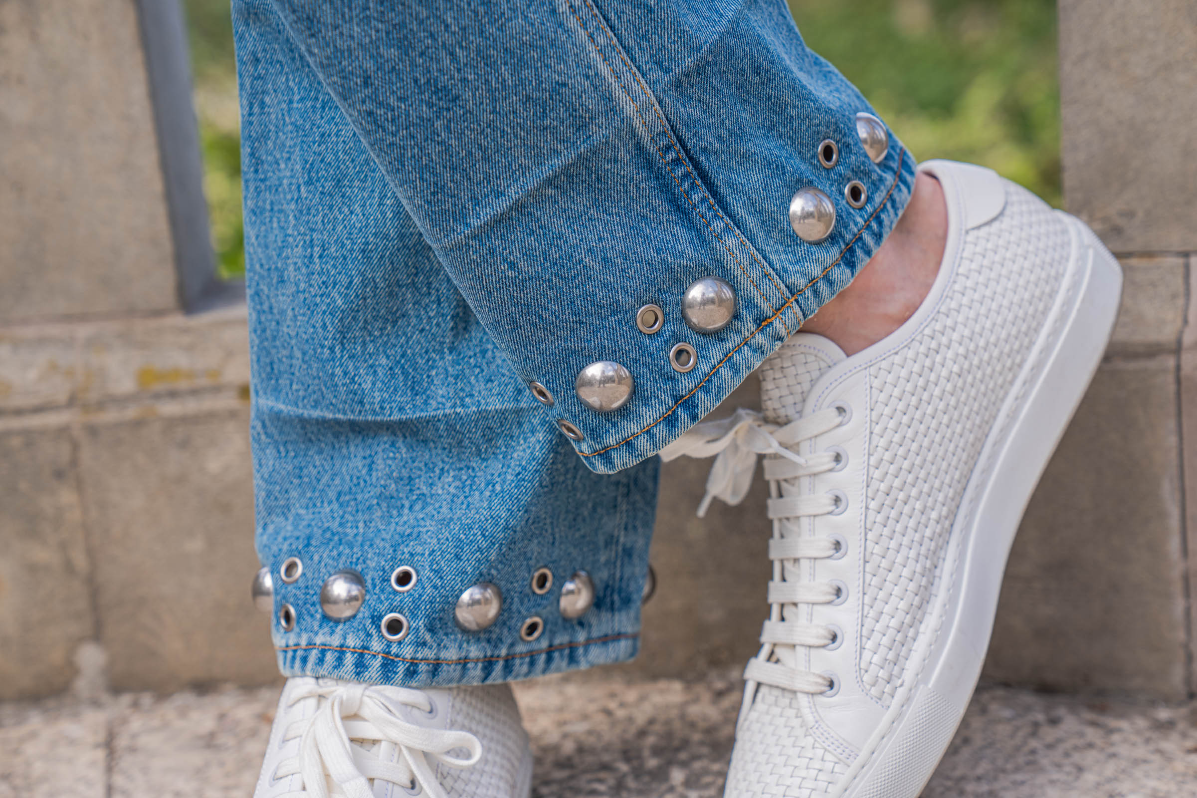 Detail of the silver studs and eyelets on the Valentino jeans hem, Mr.M blog editorial