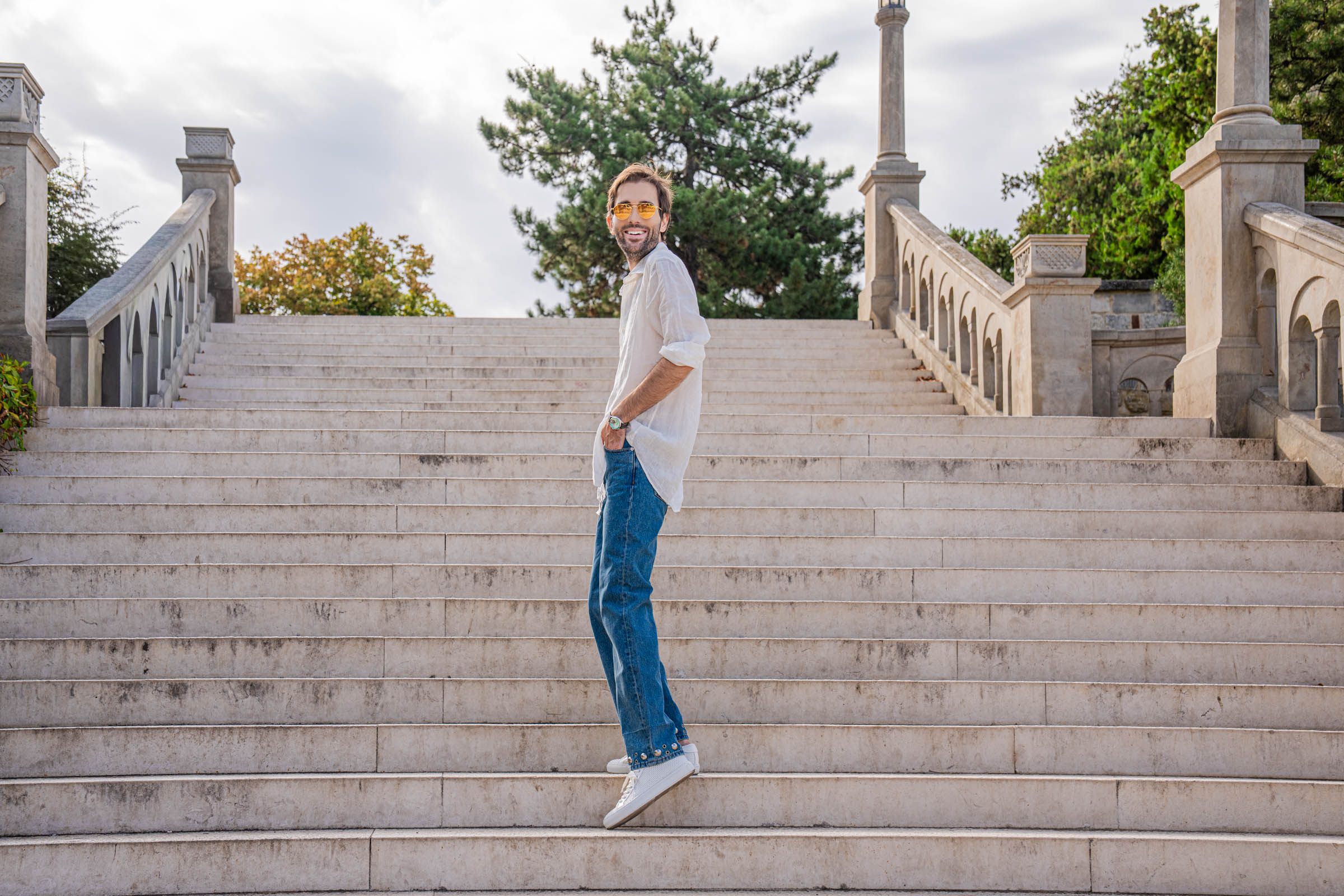 Marko Tadić on the grand staircase at Belgrade Fortress in a Valentino summer outfit